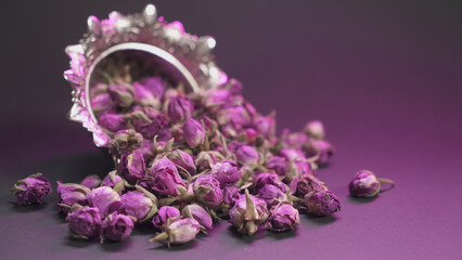 Dried rose buds in silver bowl