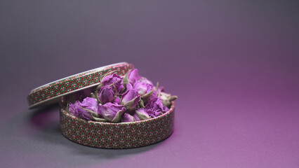 Dried rose buds in traditional bowl