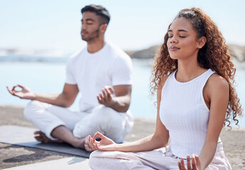 Outdoor, couple and lotus pose for meditation, mindfulness and holistic wellness beach. People, man...