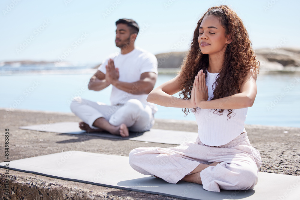 Canvas Prints Couple, yoga and ocean with namaste, peace and zen gesture with meditation and wellness outdoor. Nature, healthy people and smile with holistic and spiritual practice by the sea on a beach rock