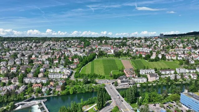 Aerial view of cityscape with Limmat River and Europe Bridge at Swiss City of Z&uuml;rich on a sunny spring day. Movie shot May 14th, 2024, Zurich, Switzerland.