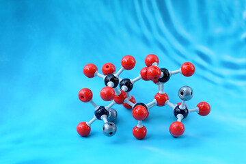 Simulate Shape of covalent molecules on a blue background. Soft and selective focus.