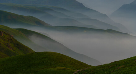 Picturesque high mountain plateau with fog in Almaty region (Kazakhstan)