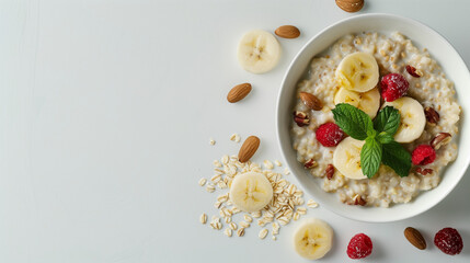 
A top view photo of porridge, in a white bowl with a white background in food magazine photography style, there are ingredients scattered around, ultra high definition