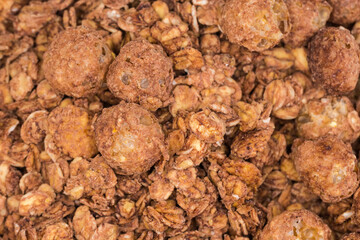 Breakfast cereals of oat flakes and corn balls with cocoa