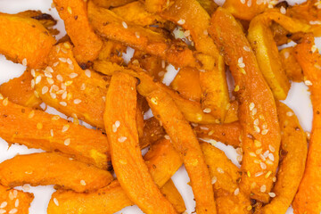 Baked slices of butternut squash, top view close-up