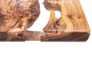 Live edge elm burl slab table top with central epoxy resin river on white background, combining...