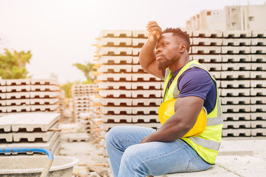 Tired stress hard worker feel bad sweating from hot weather in sunny day outdoor, Black African people global warming impact.