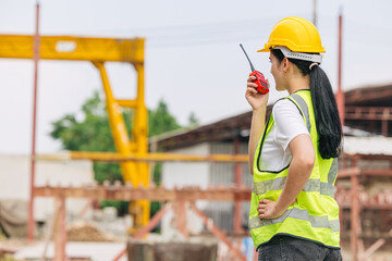Portrait Hispanic Latin Indian beautiful smart engineer woman worker supervisor in safety hardhat...