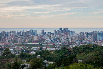 City skyline at sunset. Big port city. Skyscrapers on the coast. Gentle sunset on the sea city.