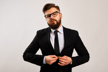 Portrait of a successful businessman on a black background. Grain effect used