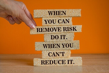 When you can remove risk, do it. When you can't, reduce it. slogan written on the brick blocks....