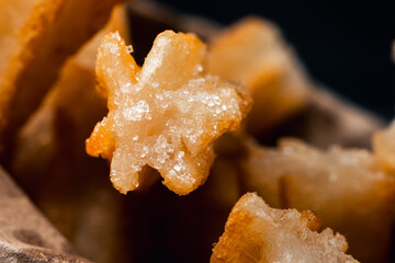 close-up of hot crocane flour churros fried in oil