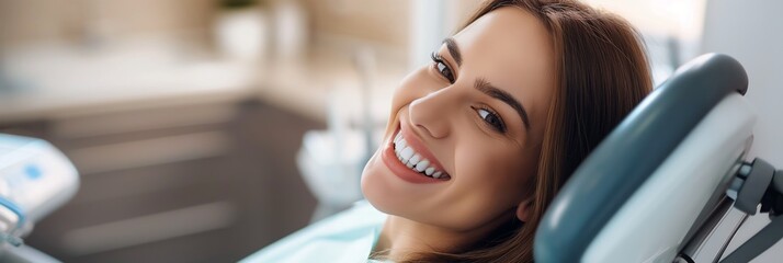 A blurred face of a female patient reclining in a dentist's chair with dental equipment around