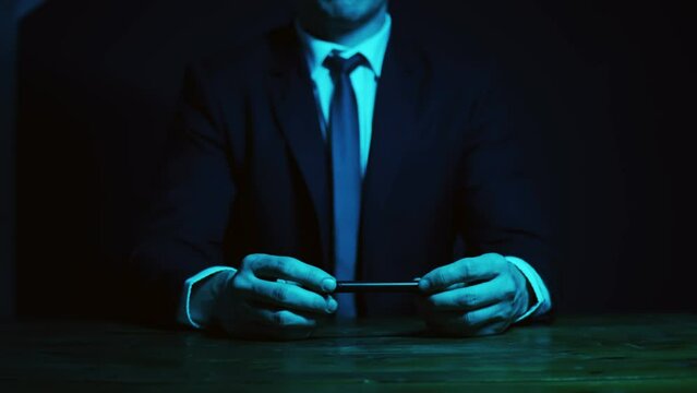 A man in a business suit puts a check mark on the completed work. The pencil draws an imaginary check mark