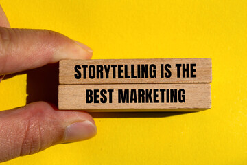 Storytelling is the best marketing words written on wooden blocks with yellow background....