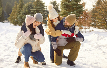 Winter fun family hugs enjoy snowy nature happiness together. Winter fun bring them closer together...