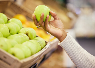 Apple, hand and grocery for shopping person, fruits and supermarket for retail and customer. Vegan, choice and ingredients for female shopper, market and fresh or organic food pick for detox diet