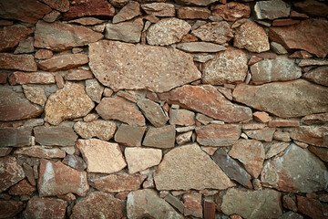Texture of a stone wall. Old castle stone wall texture background. Stone wall as a background or texture. Part of a stone wall, for background or texture
