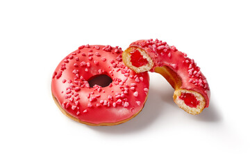 Red glazed donuts with berry jelly filling and sprinkles