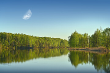 Beautiful spring landscape and morning meadow by the river. Photo wallpapers. Environmental concept. Discover the beauty of the earth.