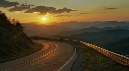 Fototapeta premium A beautiful road in the mountains with an open sky at sunset, with a asphalt surface and guardrail on both sides of it. 