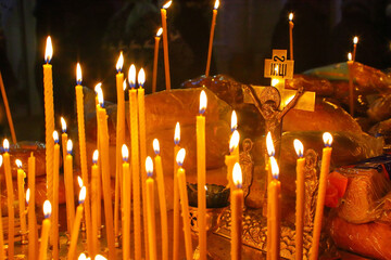 Panakhida, funeral liturgy in the Orthodox Church. Christians light candles in front of the...