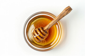 a jar of honey with a wooden spoon