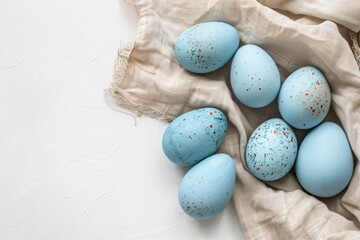 a bunch of blue eggs sitting on top of a cloth - Powered by Adobe