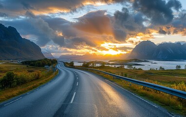 Fototapeta premium A scenic road winding through the mountains under a beautiful sunset, with a clear sky and distant hills