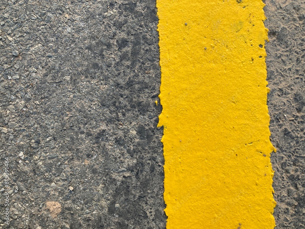 Wall mural yellow asphalt texture. yellow line on asphalt