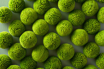 A bunch of green balls on a table. - Powered by Adobe