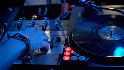Close-up a dj play music at hip hop party.