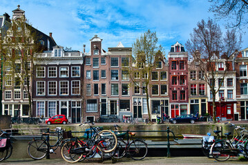 Canals of Amsterdam with bicycles parked along the canal