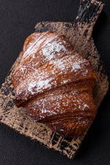 Delicious fresh sweet crispy croissant with chocolate