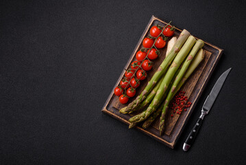 Sprigs of raw green asparagus as an ingredient for preparing a healthy breakfast