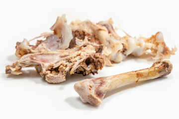 Food scraps. Chicken bones on white background.	