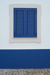 blue window with shutters