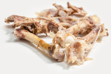 Food scraps. Chicken bones on white background.	