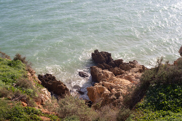 waves crashing on rocks