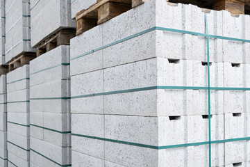 Concrete Cinder Blocks in Industrial Pallets, Grey brick Shapes building material. New for use on...