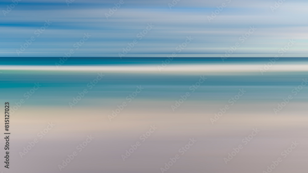 Aufkleber a blurry image of a beach with a blue ocean and white sand. the image has a dreamy, ethereal quality