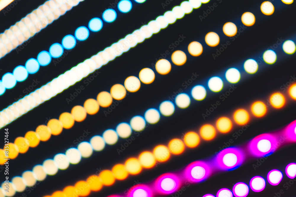 Poster a series of colorful lights are displayed in a row. the lights are in different colors and are arran