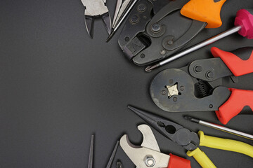 Tools for electrical work during the assembly of equipment. Close-up. Soft focus.