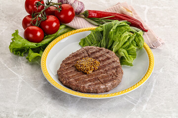 Frilled beef burger cutlet with iceberg