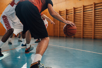 Rear view of an professional diverse players training basketball together
