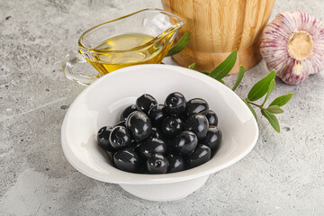 Black olives with oil and branch