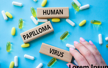 Human Papilloma Virus symbol. Concept word Human Papilloma Virus on wooden blocks. Doctor hand....