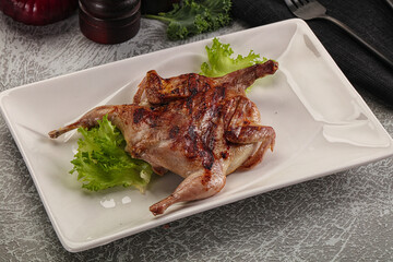 Grilled quail in the plate