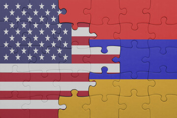 puzzle with the colourful national flag of armenia and flag of united states of america .